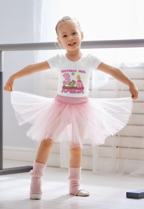 A girl wearing personalized name and age Princess Peach Super Mario theme printed birthday t-shirt Bible Verse Tees, Ballet Kids, Dancer Gift, Mermaid Shirt, Cute Mermaid, Birthday Tee, Ballet Girls, Dancing Queen, Cute Shorts