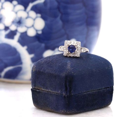 Those September ladies sure are lucky! 😁💙💫 We have here a unique square halo that is set with an unheated Ceylon Sapphire that weighs .63 cts. The vibrant gemstone is set low and square with triple bead prongs and surrounded by a square halo of 16 round diamonds. Two additional diamonds are set on the shoulders in beautiful shield shaped frames which taper to the elegant knife edged  band. The halo and side stones add an additional 1/4 carat weight. The head of the ring features a lovely ... Ceylon Sapphire, Round Diamonds, Halo, Sapphire, Diamonds, Band, Gemstones, Square, Beads