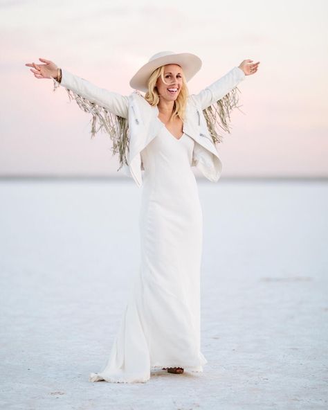 It's decided we ALL need a white fringe leather jacket!  Check out the incredible style on today's chic prairie wedding link in bio. . Photographer @studio1208 // Wedding Planner @forevercoleevents // Bride's Dress @alarobe // Bridal Salon @loho_bride // Groom's Attire @hugoboss // Groom's Tie @alexanderolch // Photo Booth @cannedhamphotos // Farm Tables @kahoystudios // Dinnerware @mariannesrentals // Furniture Rentals @rubysvintagerentals // DJ @banksentertainment // Catering @abbeyroadcaterin White Fringe Leather Jacket, White Fringe Jacket, Fringe Jacket Outfit, Traditional Bridal Look, Edgy Bridal, Prairie Wedding, Groom's Attire, Eclectic Wedding, Fringe Leather Jacket