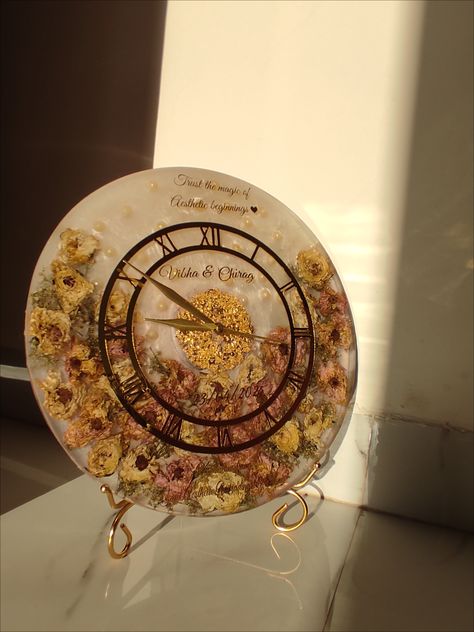 A resin clock made from Varmala roses is a unique and sentimental keepsake that preserves the roses from a wedding garland (Varmala). Varmala Preservation Ideas, Varmala Preserve In Resin, Rose Preservation, Wedding Preservation, Varmala Preservation, Resin Clock, Desi Wedding Decor, Wedding Garland, Desi Wedding