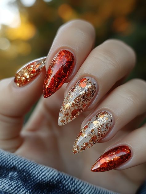 Add a touch of fall to your nails with this stunning autumn-inspired glitter nail art! These almond-shaped nails feature a rich blend of warm reds, golds, and shimmering copper tones, capturing the essence of the season. Perfect for anyone looking to make a statement with their nails this fall, this design is ideal for cozy gatherings, holiday events, or simply embracing the beauty of autumn.  #AutumnNailArt #FallNails #GlitterNails #AutumnNailDesign #NailArtInspiration Nail Art Fall, Fall Nail Design, Shaped Nails, Autumn Inspired, Nail Design Ideas, Holiday Events, Almond Shaped, Warm Red, Glitter Nail