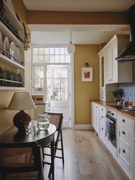 A sensitive renovation of a period property combining bold colour with personal treasures. The eclectic mix of styles and influences combine to create a home full of character and thoughtful design details. Olive Living Rooms, Edwardian Home, Greek Heritage, House Essentials, Edwardian House, Eclectic Kitchen, London Home, Boutique Interior Design, Black And White Tiles