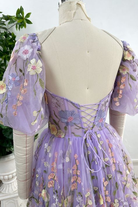 Elevate your style with our Corset Lavender Floral Embroidery Midi Dress. Featuring delicate floral embroidery and elegant puff sleeves, this piece combines femininity and sophistication. Embrace luxury in this exclusive dress. Bust and Skirt with full lining. 100% Polyester 100% Recycled polyester lining Concealed zip at center back Imported Purple Puff Sleeve Dress, Simple Corset, Floral Corset Dress, Patterned Bridesmaid, Midi Prom Dress, Purple Corset, Dress With Puff Sleeves, Lavender Tea, Sweetheart Prom Dress