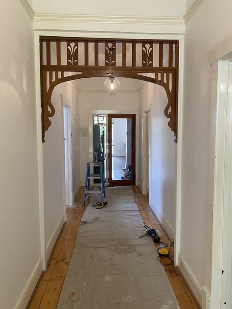 Arched Doorway Interior, Corbels Hallway, Hallway With Beams, Frame A Doorway, Craftsman Archway, Wooden Archways In Homes, Scalloped Archway, Rounded Archways In Homes, Corridors With Arched Doors