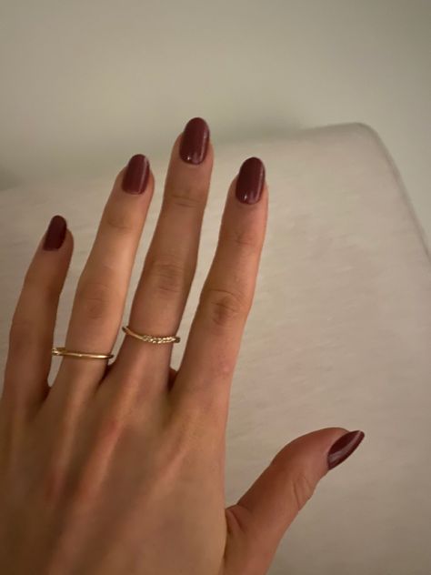 red almond manicure nails with simple gold jewelry Brunette Gold Jewelry, Short Almond Dark Red Nails, Simple Gold Jewelry Aesthetic, Dark Red Natural Nails, Red And Gold Jewelry Aesthetic, Timeless Formal Red Rings, June Nails Ideas 2024 Almond, Everyday Minimalist Red Rings, Red Nails Gold Jewelry