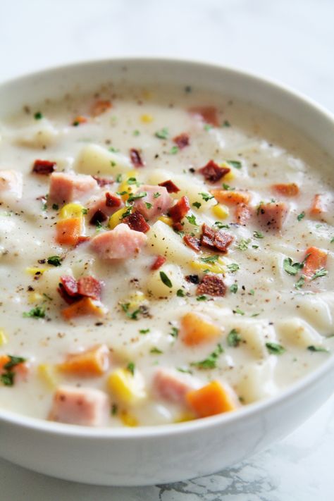 Hearty, creamy chowder loaded with smoked ham, potatoes, and sweet corn. Can you believe we have just two more summer days left?!  I’m a bit sad about it, but I’m excited about fall seasonal things.  Call me crazy…I’ve already picked up some mini pumpkins and gourds to decorate the apartment with! :)  And I have waited long enough…for soups, … Ham Potato Chowder, Potato And Corn Chowder, Ham Chowder, Potato Corn Chowder, Ham Potato, Potato Chowder, Corn Chowder Recipe, Creamy Recipes, Chowder Recipe