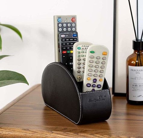 This remote-control organizer because it's much better than just leaving your remote on the couch where it'll inevitably slip between the cushions, and you'll inevitably spend 30 minutes searching for it in all the wrong places. Remote Caddy, Tv Holder, Remote Control Storage, Remote Holder, Bilik Mandi, Remote Control Holder, Leather Organization, Pen Storage, Store Organization