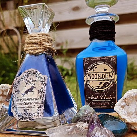 Make Some Potions with Me 🤩 Moondew and Wolfsbane🌙✨️ You can now watch these potions being made in my new reels 🤩 Made with a beautiful bottle from my local thriftstore and vibrant aquarel watercolours ❤️‍🔥 #potion #witchaesthetic #witch #potions #wolf #moondew #blue #werewolf #brewing #magic #whimsicalworkshop #fantasy #shiny #gems #amathist #geode #wolfsbane Blue Werewolf, Wolfsbane Potion, Witch Potions, Halloween Potion, Fantasy Map Making, Halloween Potion Bottles, Map Making, W.i.t.c.h Aesthetic, Halloween Potions