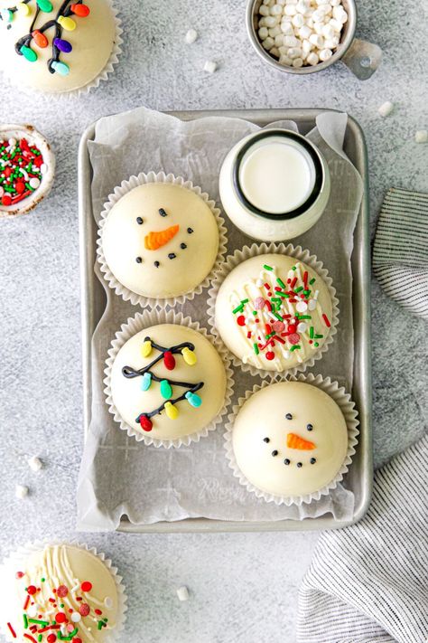 Christmas hot cocoa bombs decorated 3 different ways: jolly snowman, string of lights, and truffle-style hot chocolate balls. They're arranged on a metal tray with a glass bottle of milk and extra marshmallow bits and Christmas sprinkles. Hot Chocolate Balls, White Chocolate Candy, Gluten Free Candy, Chocolate Balls, String Of Lights, Christmas Hot Chocolate, Hot Cocoa Mixes, Chocolate Bomb, Cocoa Mix