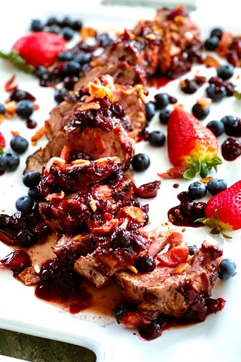 Grilled Pork Tenderloin with Berry Bacon Sauce. Sweet. Savory. Salty. Smokey. Saucy. Barbecue spiced and char grilled pork tenderloin. Top with a tart, sweet and smoky bacon berry laden sauce. An unforgettable dinner. #porkbaconberry #baconberrysauce #dinnerideas#porktenderloinrecipe Bbq Pork Tenderloin, Blueberries And Strawberries, Bacon Sauce, Grilled Pork Tenderloin, Pork Loin Recipes, Pork Bacon, Berry Sauce, Bbq Bacon, Pork Glaze