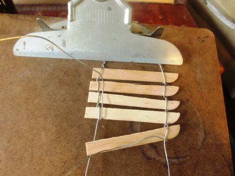 Making a picket fence:20-22 gauge craft wire Popsicle sticks or twigs Needle nosed pliers clipboard  and paint Fairy Garden Fence, Fairy Garden Kit, Fairy Garden Furniture, Diy Fence, Fairy Furniture, Fairy Garden Supplies, Mini Fairy Garden, Fairy Crafts, Popsicle Stick Crafts