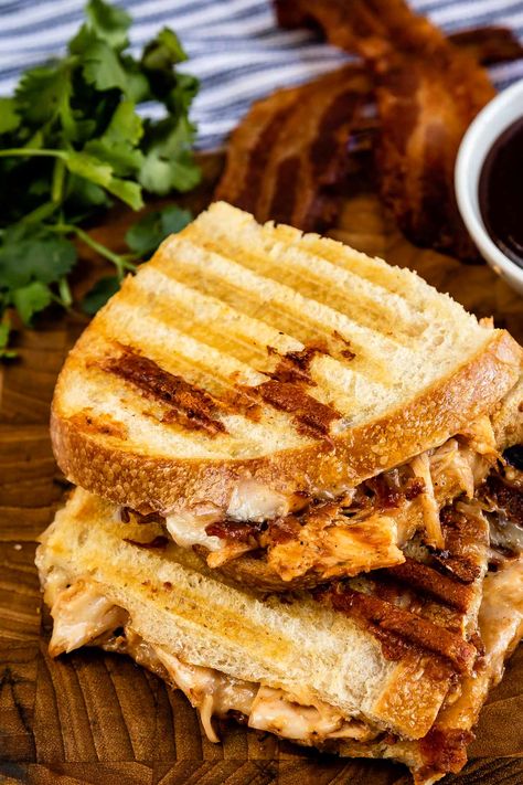 This BBQ Chicken Panini is a grilled sandwich that is full of shredded chicken, bacon, tangy BBQ sauce, and melted cheese! Bbq Chicken Panini, Bbq Chicken Grilled Cheese, Best Panini Recipes, Chicken Panini Sandwiches, Chicken Bacon Sandwich, Sandwich Recipes Panini, Panini Recipes Chicken, Panini Recipe, Chicken Panini