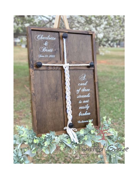 "This custom braided cross, otherwise know as God's knot, unity wedding sign, 'Eccl 4 12' or 'A cord of three strands', is the perfect alternative for your unity ceremony in placement of the unity candle or unity sand ceremony for a non traditional unity ceremony. It is a fitting piece to have at your vow renewal ceremony or anniversary party! It is also the perfect Wedding gift, Anniversary gift, Valentines Day gift or simply a just because couples gift! It symbolizes the bonding of Man, Wife and God to be united in a strong unbreakable covenant.  Ecclesiastes 4:12 \"A cord of three strands is not easily broken\" what better way to symbolize your commitment? The best part is, you will always be reminded of that bond as it hangs on your wall as décor or sits on your mantle as a reminder th Three Cords Wedding Unity Ceremony, Unity Cross Wedding, Unity Ceremony Braid, Unity Ceremony Ideas, Unity Cross, Cross Sign, Wedding Ceremony Unity, Unity Sand Ceremony, Cord Of Three Strands