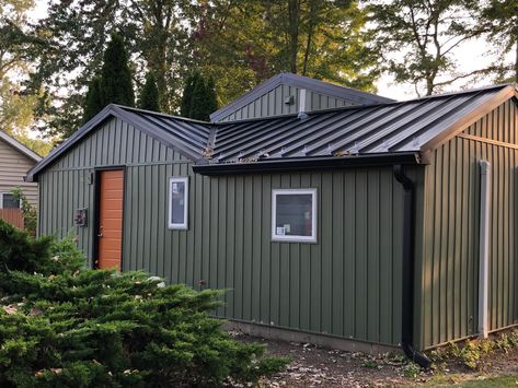 Metal Roof Dark House, Black Steel Roof House, Black Metal Roof Green Siding, Board And Batten With Metal Roof, Mobile Home Metal Roof Colors, Board And Batten Siding With Metal Roof, Dark Green Metal Siding, Black Metal Roof Houses, Black Tin Roof