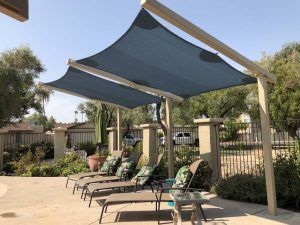 Canvas Sail Shade Patio, Poles For Sun Shade Sail, Sail Cloth Patio Cover, Shade Sail Over Pool, Triangle Sun Sail Shade Ideas, Sail Shade Post Ideas, Shade Over Pool, Sun Shade Sail Ideas, Sun Sail Shade Ideas