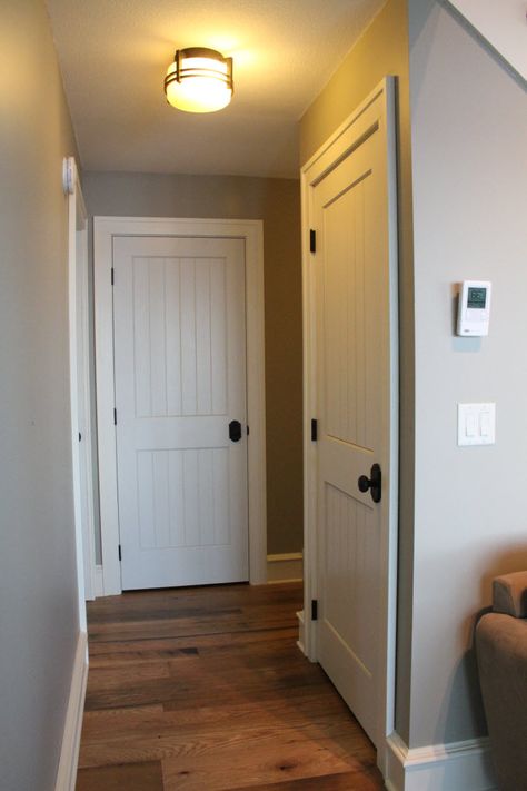 Interior Doors | sleek cottage style with white molded plank doors | Bayer Built Woodworks Cottage Doors Interior, English Doors, Modern Farmhouse Interior Doors, Farmhouse Interior Doors, Cottage Doors, Interior Panel Doors, Rustic Wood Doors, Plank Door, Barn House Interior