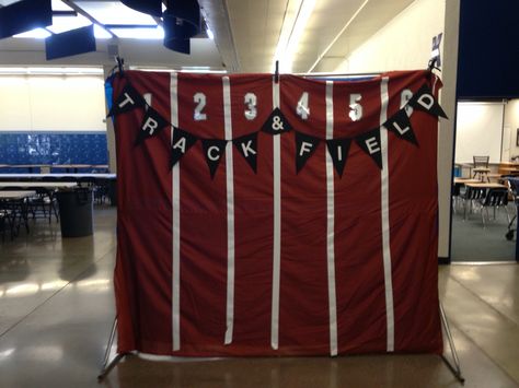 Track and field banquet photo backdrop. Instead of a super expensive photo booth, I made my own backdrop to take fun photos in front of. This is burnt red fabric with white duct tape and iron on numbers. Banquet Photo Backdrop, Banquet Outfit Ideas, Track Banquet, Track And Field Games, Sports Day Decoration, Church Youth Activities, Banquet Outfit, Banquet Centerpieces, Team Dinner