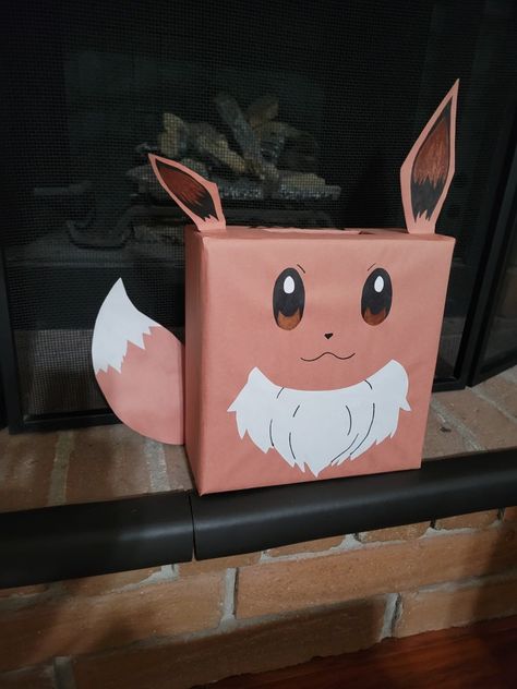 Pokemon Eevee diy Valentine's mailbox Pokemon Valentines Box Ideas, Pokemon Valentines Boxes For Boys, Pokémon Valentine Boxes, Pikachu Valentines Boxes, Pokemon Ball Valentines Boxes, Eevee Valentine Boxes, Pokemon Valentine Box Ideas, Valentines Box Pokemon, Diy Pokemon Valentines Boxes