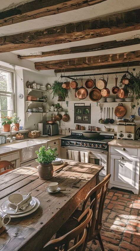 Rustic kitchen with exposed beams, vintage decor, wooden table, copper pots, and green plants. Brick Floor Kitchen, Farmhouse Boho Decor, Kitchen Open Shelves, Cottagecore Home Decor, Boho Farmhouse Decor, Farmhouse Boho, Brick Flooring, Diy Furniture Renovation, Cottage Interiors