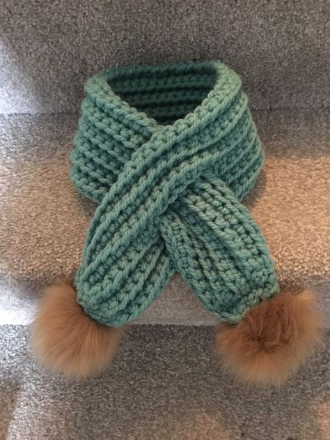 Pull-through Pom-Pom scarf crochet project by Sarah S | LoveCrafts Crochet Pom Pom, Chunky Crochet Scarf, Bernat Softee Chunky, Pompom Scarf, Baby Scarf, Universal Yarn, Christmas Knitting Patterns, Scarf Crochet, Cascade Yarn