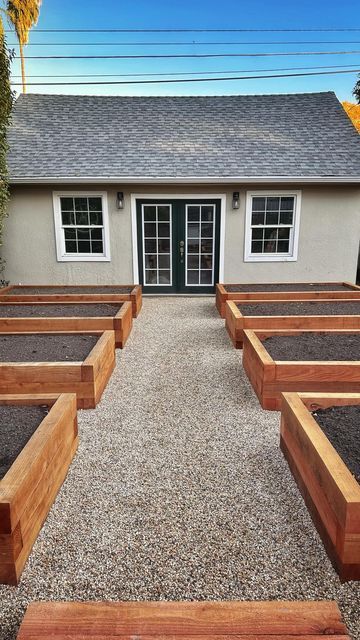 Kyle Hagerty | Urban Farmstead on Instagram: "Finishing off the garden pathways with pea gravel. The base layer is 4” of road base for drainage and stability, capped with 3/4” of DG to seal in the big rocks, then finished off with 1” of this 3/8” Ione Gold. After building two previous gardens with DG (decomposed granite) pathways, I’ve decided that I do love a well made DG path, but it gets messy with spilled soil, does get some weeds, and can get muddy, especially if it’s not installed properl Tortoise Backyard, Crushed Rock Pathway, Urban Farmstead, Garden Remodel, Pea Gravel Garden, Garden Gravel, Backyard Raised Garden, Gravel Backyard, Raised Planters