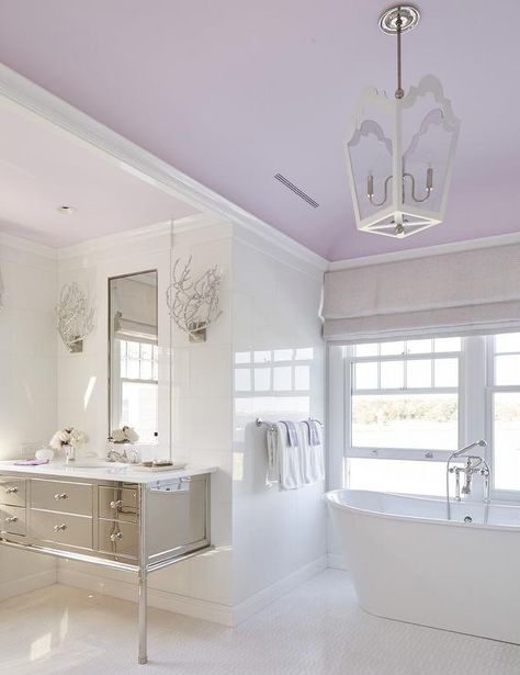 Calming purple and white contemporary bathroom boasts a freestanding tub placed… Elderly Bathroom, Paint Ceiling, Lavender Bathroom, The Sistine Chapel, Silver Bathroom, Purple Bathrooms, Bathroom Paint, Bathroom Diy, Bathroom Ceiling