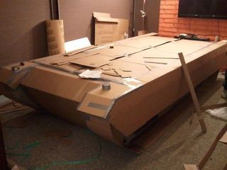 My buddies and I were trying to think of something we could build out of cardboard and duct tape. We came up with a tank. It was a little more costly than originally... Cardboard Tank, Army Bedroom, Paper Tanks, Cut Hoodies, Christmas Parade Floats, Military Crafts, Floating Decorations, Army Party, Cut Up Shirts