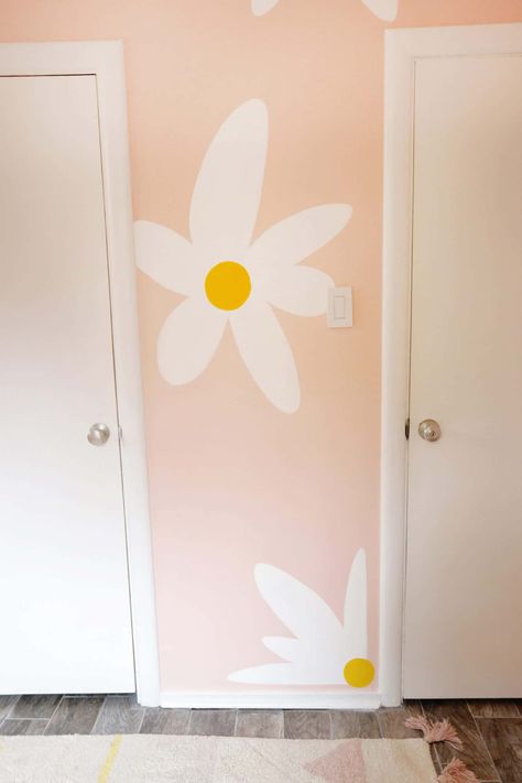 Lola's Painted Daisy Wallpaper - A Beautiful Mess Flowers Painted On Wall Nursery, Daisy Wall Paint, Diy Daisy Wall Paint, Hand Painted Daisy Wall, Daisy Wall Mural Diy, Diy Painted Flowers On Wall, Diy Painted Flower Wall, Flowers Painted On Wall, Flower Painted Wall