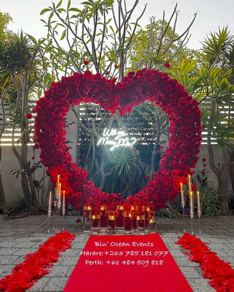 Love is in the air! ❤️✨ This stunning red heart arch set the perfect scene for a magical proposal. Here’s to love stories that begin with unforgettable moments like these. 💍🌹 Let us help you create the proposal of your dreams! 💕 #perthisok #zimweddings #Hararedecor #hararepicnics #perthpicnics #proposalideas #romanticsetup #proposalplanner #engagementdecor #luxurydecor #redandromantic #loveinfullbloom #proposalgoals #decorinspo #eventplanner” Black Couple Proposal Ideas, Heart Arch Proposal, Black Couple Proposal, Magical Proposal, Heart Arch, Couple Proposal, Party Planning Business, Proposal Planning, Flowers Heart