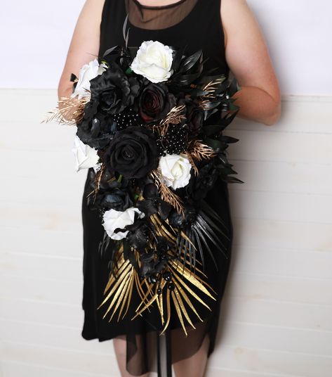 Black gold white roses wedding bouquet, black gold ivory roses cascading bouquet gothic black ivory roses wedding bouquet black gold wedding The photo shows a Bridal bouquet ( 22"* 16" ) The bouquet consists of fabric flowers. Bridesmaids bouquet: Approximate Length: 12" Approximate width: 10" Bridal bouquet: Approximate Length: 22" Approximate width: 16" The normal time of air delivery: ♥ -USA- 14-30 day ♥ -Europe- 12-20 day ♥ -Canada, Australia- 10-30 day Usually 10-17 business days, but somet White Roses Wedding Bouquet, Wedding Bouquet Black, Roses Wedding Bouquet, Flowers Bridesmaids, White Rose Wedding Bouquet, Cascading Bouquet, Black Gold Wedding, White Roses Wedding, Bridesmaids Bouquet