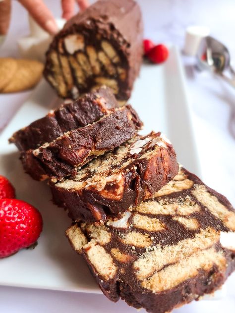 No bake? No flour? No egg? Count me in!! This simple to make, no bake chocolate lazy cake is divine. I mean it's called "lazy", so it does not get much easier than this! I love this recipe and always make it whenever I have guest over. Gooey chocolate and crunchy, buttery biscuits combine to form a beautiful slice of cake. Served frozen, it is the perfect summer treat. Bon Appétit! No Bake Biscuit Cake, Baked Marbles, Lazy Cake, Mediterranean Desserts, Cake Recipes Without Eggs, Chocolate Biscuit Cake, Healthy Chocolate Cake, Slice Of Cake, Sweet Recipe