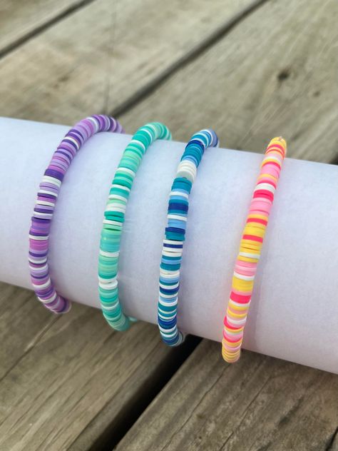 aesthetic clay beaded bracelets in 4 colors! Clay Bead Bracelet Ideas Spring, Fall Clay Beads Bracelet Ideas, Aesthetic Clay Bead Bracelets, Bracelet Inspo Clay Beads, Clay Bead Bracelet Ideas Aesthetic, Bracelet Ideas Aesthetic, Polymer Clay Bead Bracelet, Clay Beaded Bracelets, Bracelets Preppy