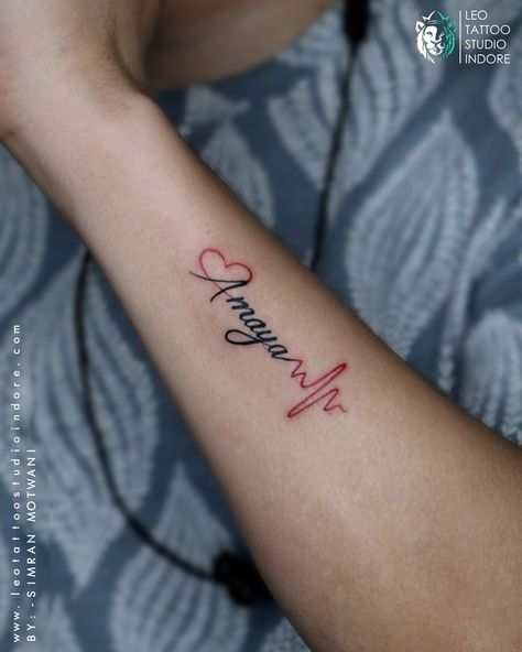 Heartbeat tattoos with name can be joined with cute components that add to the delightful and beauty of the design at Leo tattoo studio Indore. Script Name Tattoo, Name Tattoo With Heart, Heartbeat Tattoo With Name, Heartbeat Tattoos, Tattoo With Heart, Heartbeat Tattoo Design, Heart Tattoos With Names, Leo Tattoo, Heartbeat Tattoo