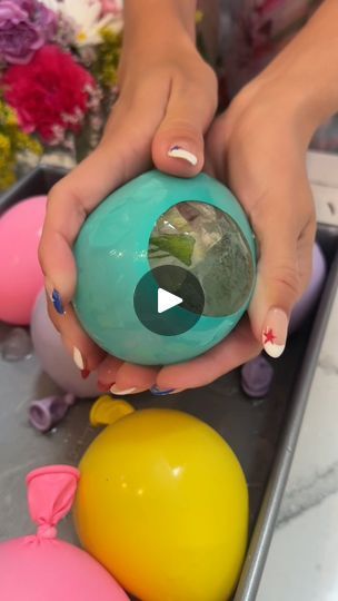 7M views · 36K reactions | Frozen Roses are amazing! 🌹😍 | Frozen Roses are amazing! 🌹😍
Janelle freezes flowers in balloons and the result is incredble. Definitely a showstopper for any party. | By Janelle & Kate | You pop it off just like that.
Grab your balloon in. See? It's in there. You can do it. If you
have a person to help you, it really does help but you can do
it on your own One more time. Here is the
balloon. And you just oh literally 2 seconds. It's so
easy. All you have your little ice balls. So I just cannot
wait to open these up for you because they're so cool. These
are 12 inch. These are just fancy edible packets of these
sprinkles. Some sprinkles and this is going to make the
entire ball super sparkly. Take all of my I shook them up
because they have some glitter in the Frozen Roses, Flower Ice Cubes, Frozen Rose, Bar Business, Chill Drinks, Flower Ice, Amazing Crafts, Ice Ball, Healthy Drinks Recipes