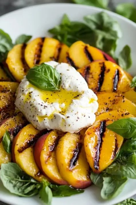 Experience the delightful combination of sweet grilled peaches and creamy burrata in this refreshing salad! Perfect for summer gatherings, this colorful dish will impress your guests and satisfy your taste buds. Learn how to make this easy peach salad with hints of aromatic herbs and zesty dressings that elevate the flavors brilliantly. Your family will love digging into this healthy recipe that blends fruit and cheese in a way you never thought possible. Don't miss out on serving this unique and mouthwatering salad as a light meal or adventurous side dish! Unique Fruit Salad, Peach Salad Dressing, Peach Burrata Salad, Peach And Burrata, Peach Burrata, Burrata Salad, Fresh Salad Recipes, Colorful Dishes, Grilled Fruit