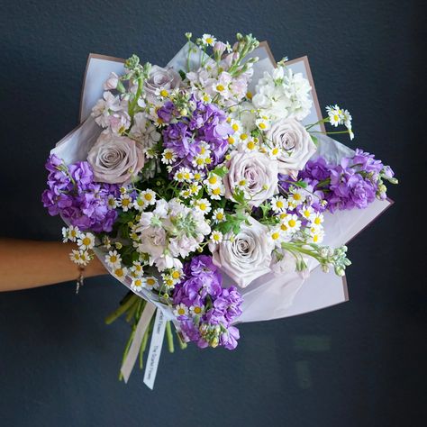 If the Scarlet flower wasn’t red, it would be purple. Take a walk through purple fields with this luscious lavender bouquet which includes: Rose, Stock, Chamomile and a little bit of Our Love. Perfect gift for your loved one who loves purple! Size “Standard” in the picture. OC and LA County same day delivery available. 🚗 Have any questions or looking for something more specific? Call us now at (213) 214 - 0044 Hoco Boquets, Yellow Wedding Flowers Bouquet, Hoco Flowers, Purple Hoco, Purple Field, Lavender Bridal Bouquet, Homecoming Flowers, Purple Flower Bouquet, Sunflowers And Roses