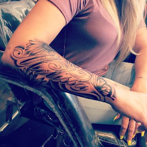 Half sleeve tattoo. Sunflowers and butterflies with my Sisters name 😇 Sleeve Tattoos With Names, Half Sleeve Name Tattoos For Women, Sleeve Tattoos Feminine, Name Tattoo On Forearm For Women, Sleeve Tattoo With Names, Name Sleeve Tattoo For Women, Multiple Name Tattoos, Sunflower Name Tattoo, Sunflower Tattoo With Name