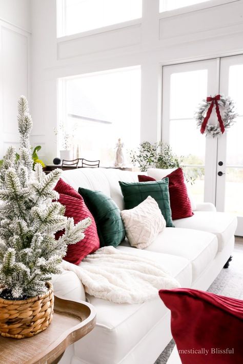 Gold And Wood Decor Living Room, Christmas Couch Decor, Flocked Wreaths, Domestically Blissful, Christmas Coffee Table, Hanging Wreaths, Green And Gold Christmas, Decoration Ideas Christmas, Flocked Garland