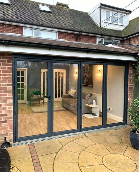 A set of bifold doors recently installed in a home in Surrey!💫⁠
⁠
With a convenient traffic door on one side, they offer the ultimate flexibility for those moments when you don't want to fully swing open the doors but still need access.⁠
⁠
Whether it's a quiet morning coffee on the patio or a lively evening gathering with friends, these bifold doors adapt to your lifestyle so effortlessly. They are perfect in the warmer months when you can open up the entire space onto the garden!⁠ Bifold Doors Onto Patio, Bi Folding Doors, Bifold Patio Doors, Quiet Morning, Roof Lantern, Aluminium Windows, Summer Sunshine, Casement Windows, Roof Light