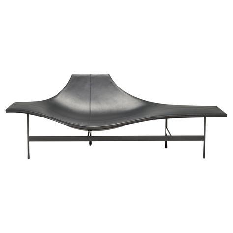 This black chaise lounge was created in 2008 by French architect, inventor and designer Jean-Marie Massaud. The flowing lines of the seat contrasts strikingly with the linear, structural metal base, as do the glossy and matt finishes. With its dual function of armchair and chaise lounge, the piece balances comfort and functionality without sacrificing elegance. Every contour of the seat is designed to suitably hold and embrace the body, whilst the stitching on the leather forms a cross in the se Black Chaise Lounge, Jean Marie Massaud, Contemporary Lounge, Monochrome Color Palette, Designer Jeans, B & B, Metal Base, Chaise Lounge, Living Spaces