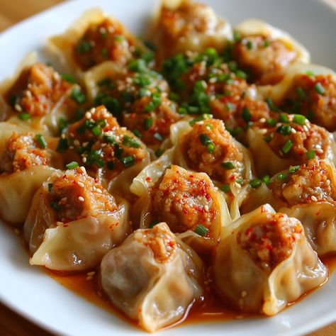 🥟🌶️ Enjoy the bold flavors of Kimchi Mandu, spicy kimchi dumplings! A Korean delight! 🥢✨ #KoreanCuisine #DumplingLove Kimchi Mandu (Kimchi Dumplings) Ingredients: Kimchi (1 cup, chopped) Ground pork (1/2 lb) Tofu (1/2 cup, crumbled) Garlic (2 cloves, minced) Green onions (2, chopped) Soy sauce (1 tbsp) Sesame oil (1 tsp) Dumpling wrappers (20) Salt and pepper (to taste) Instructions: Mix kimchi, pork, tofu, garlic, green onions, soy sauce, sesame oil, salt, and pepper. Place a spoonful of... Kimchi Mandu, Mandu Recipe, Kimchi Dumplings, Kimchi Pork, Soy Dipping Sauce, Korean Dumplings, Spicy Kimchi, Instagram Recipes, Dumpling Wrappers