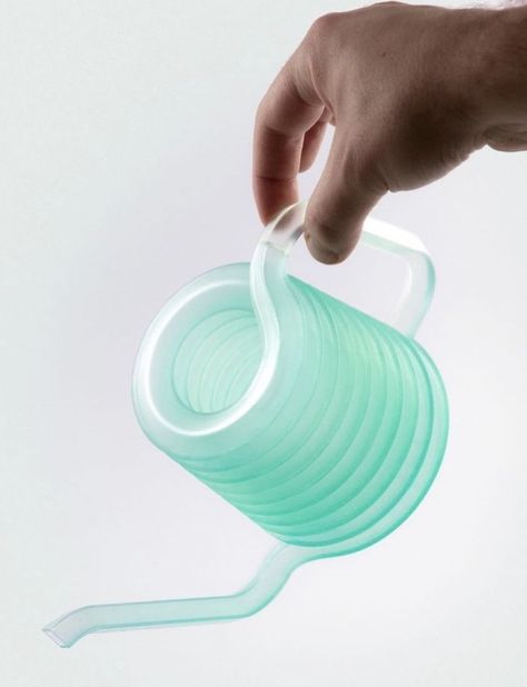 this lovely little playful design is a contemporary take on an age-old tool - the watering can. Called Coil, the can is a result of the exploration of the unique and expansive capabilities of resin 3D printing. The functional, aesthetic, and intricate product can be created at home with the use of any 3D printer. It transforms the task of filling a watering can with water and watering your plants into an amusing, whimsical, and intuitive experience. 3d Printed Watering Can, Crazy Straws, Plastic Texture, Robotic Pool Cleaner, 3d Printing Diy, Top Tv, Water Bottle Covers, Old Tools, Yanko Design