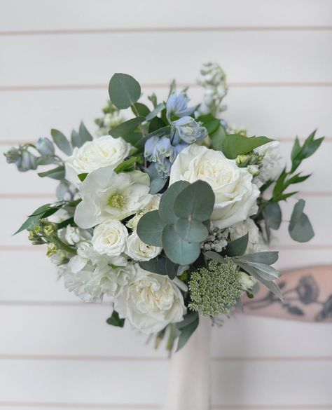 Our blue and white bridal bouquet is giving us all the romantic vibes. Perfectly pairing greys with soft whites, it’s a little piece of magic for your special day! Who else is crushing on these colors? 😍💍⁠ ⁠ *  ⁠ *  ⁠ *  ⁠ #BridalBliss #BouquetGoals #BMFFlowers⁠ #2024weddings #flowerdeliverybrisbane #brisbanemarketflowers Blue And Yellow Bridesmaid Bouquet, Winter Formal Bouquet, White Green And Blue Bridal Bouquet, Wedding Bouquet Ranunculus, Light Blue And White Bouquet, Wedding Bouquets With Blue, Blue And White Wedding Bouquets, Blue Wedding Bouquet Ideas, Blue White And Green Wedding