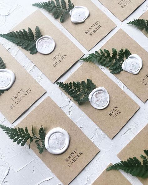 White details with greenery for elegant place settings Placecards Wedding Table, Forest Wedding Reception, Wax Seal Wedding, Fern Wedding, Riverside Weddings, Wedding Reception Planning, Place Cards Wedding, Forest Theme Wedding, Wedding Greenery