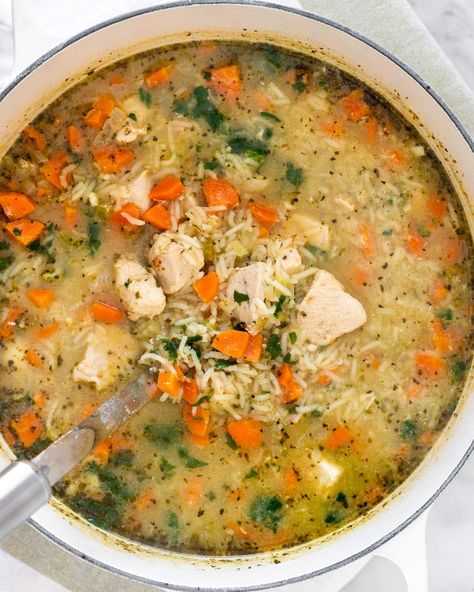 This Chicken and Rice Soup is comforting made with everything you need in a meal. Protein, carbs, and lots of veggies! It'll leave you warm and filled up after just one bowl. #chicken #rice #soup #recipe Mirepoix Recipe, Oven Chicken And Rice, Dutch Oven Soup Recipes, Dutch Oven Chicken Breast, Dutch Oven Soup, Dutch Oven Recipes Cast Iron, Chicken Veggie Soup, Bowl Chicken, Spinach Soup Recipe