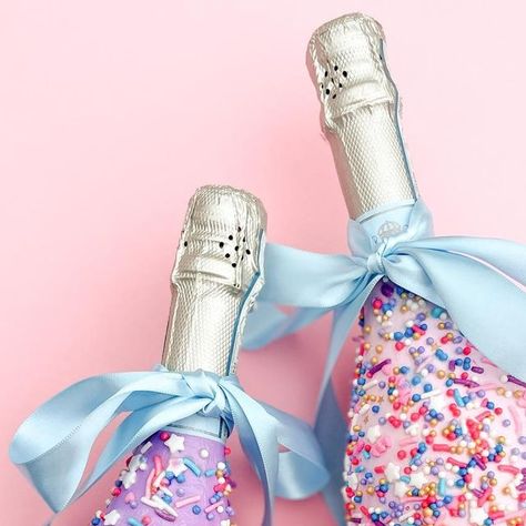 Bess Garcia on Instagram: "Life is worth celebrating 🎉 cheers to year 33! 

Wanted these cuties to have a spot on the feed 🤩 also shout out to my girl @wrappednewyork for the original sprinkle bottle idea! 

#handpaintedchampagnebottle #giftideas #customgiftbox #giftingideas #giftingsolutions #curatedgifts #dallaspaintedbottles #customchampagnebottle #paintedchampagnebottles #dallasgiftshop #dallasgiftmarket #bridesmaidproposal #maidofhonorproposal #dfwweddings #dallaswedding #customhomepainting #customdogpainting #custompetpainting #pearlchampagne #glitterchampagne #paintedwoodfordreserve #paintedbourbonbottle #artist #dallasartist #localartistsupport #localartist" Custom Champagne Bottle, Glitter Champagne, Custom Pet Painting, Custom Gift Boxes, Champagne Bottles, Dallas Wedding, Bottle Painting, Instagram Life, Curated Gifts