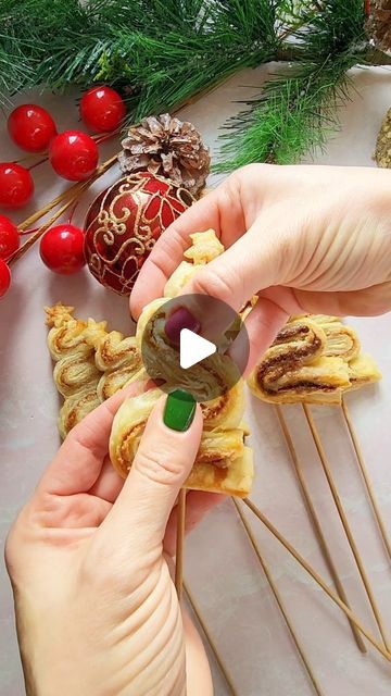 Sasha Aleksandra Nary on Instagram: "Puff Pastry Christmas Tree Pops ~ Nutella and Biscoff🎄 Follow @sashacakeschicago for more! Easy holiday dessert idea from ly, two ways! Which one are you, nutella or biscoff?😍

You will need:

Thawed Puff Pastry (2 sheets)
2 - 4 tbsp of warmed up nutella
2 - 4 tbsp of warmed up biscoff
Egg white or egg wash
Granulated sugar (optional, as garnish)

Directions:

Preheat oven to 375°F.
Spread 2-4 tbsp of warm (easier to work with) nutella on half of the pastry, and 2-4 tbsp of biscoff - on the other half. Cover with another sheet of pastry. Mine ends up measuring at 24"×36". Reserve any cut-outs for later.
Using a ruller, cut 1" wide strips and fold each in an "accordion" way, resembling the Christmas tree and slide through a wooden skewer.
Using the sma Puff Pastry Christmas Tree, Pastry Christmas Tree, Puff Pastry Christmas, Pastry Christmas, Easy Holiday Dessert, Holiday Desserts Christmas, Easy Holiday Desserts, Holiday Dessert, Egg White