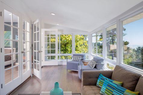 Bright white sunroom with wood flooring, french doors and great views Closed Front Porch, Closed In Front Porch Ideas, Closed In Front Porch, Three Season Room Ideas, Closed Porch, Porch To Sunroom Conversion, Sunroom Conversion, Screen Porch Panels, Small Sunroom Ideas