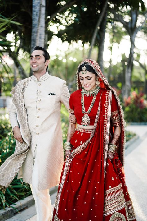 A Gorgeous Seaside Wedding With The Bride Who Wore The Same Lehenga As Deepika Bridal Lehngas Indian, Red Bridal Lehenga Indian, Red Lehenga Bridal, Sabyasachi Lehenga Bridal, Sabyasachi Bridal, Pengantin India, Latest Bridal Lehenga, Sabyasachi Lehenga, Couple Wedding Dress