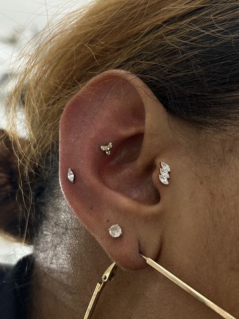 MINI CURATION COMING IN HOT 🔥  TRAGUS, MID HELIX, AND OUTER CONCH BY @lobopiercings   Soho, Union Square, and Williamsburg  11AM-9PM 7 DAYS A/W🕘 WALK-INZ OR BOOK ONLINE..📕 TATTOOS & PIERCINGS, NO ATTITUDE, NO MISERABLE HOOPS TO JUMP THROUGH....🚫 WALK-INZ WELCOME OR BOOK ONLINE AT ⚔️livebytheswordtattoo.com⚔️ . . . . #livebythesword #earcuration #piercingcheck #nycpiercing #piercingjewelry Mid Ear Piercing, Contra Conch, Mid Helix Piercing, Outer Conch Piercing, Outer Conch, Ear Curation, Pretty Ear Piercings, Cute Ear Piercings, Conch Piercing